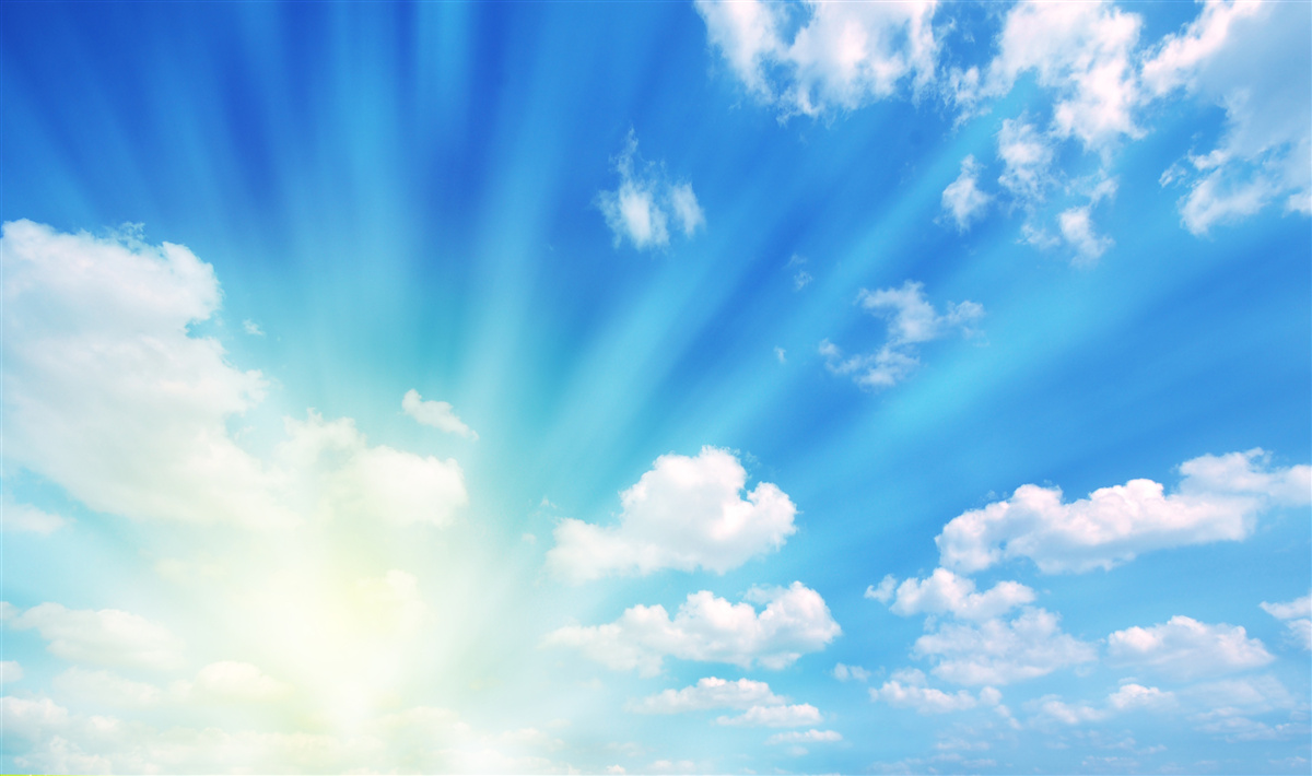 Fototapeten Die hellen Sonnenstrahlen scheinen am blauen Himmel