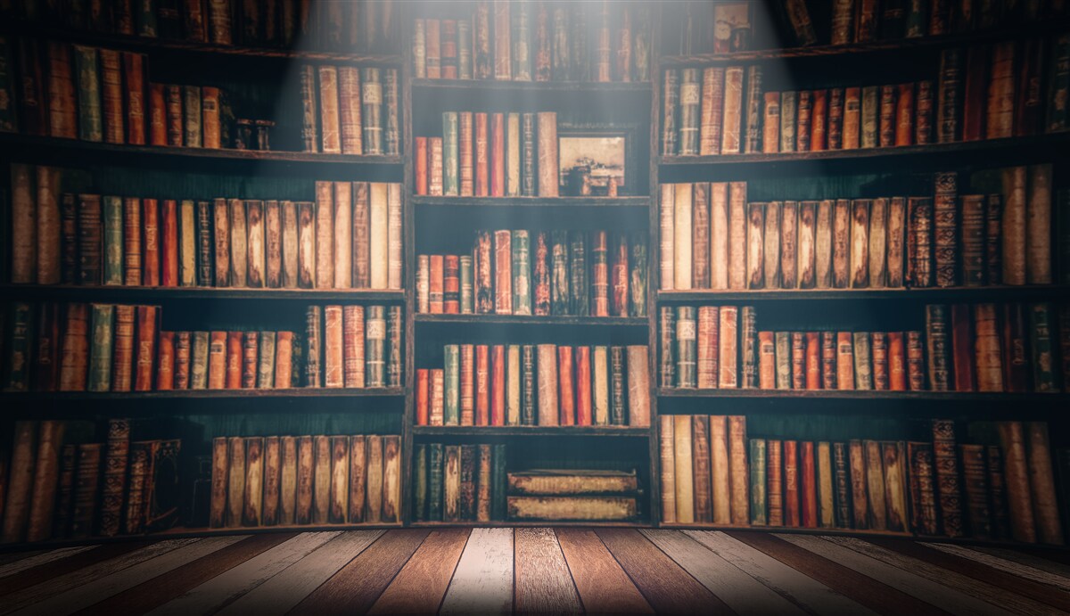 Fototapeten Ein Sonnenstrahl durchdringender Bücher