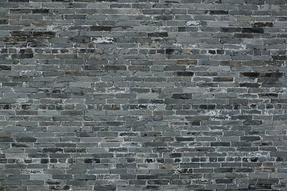 Fototapeten Die Wand aus Ziegel hat einen dunkelgrauen Farbton