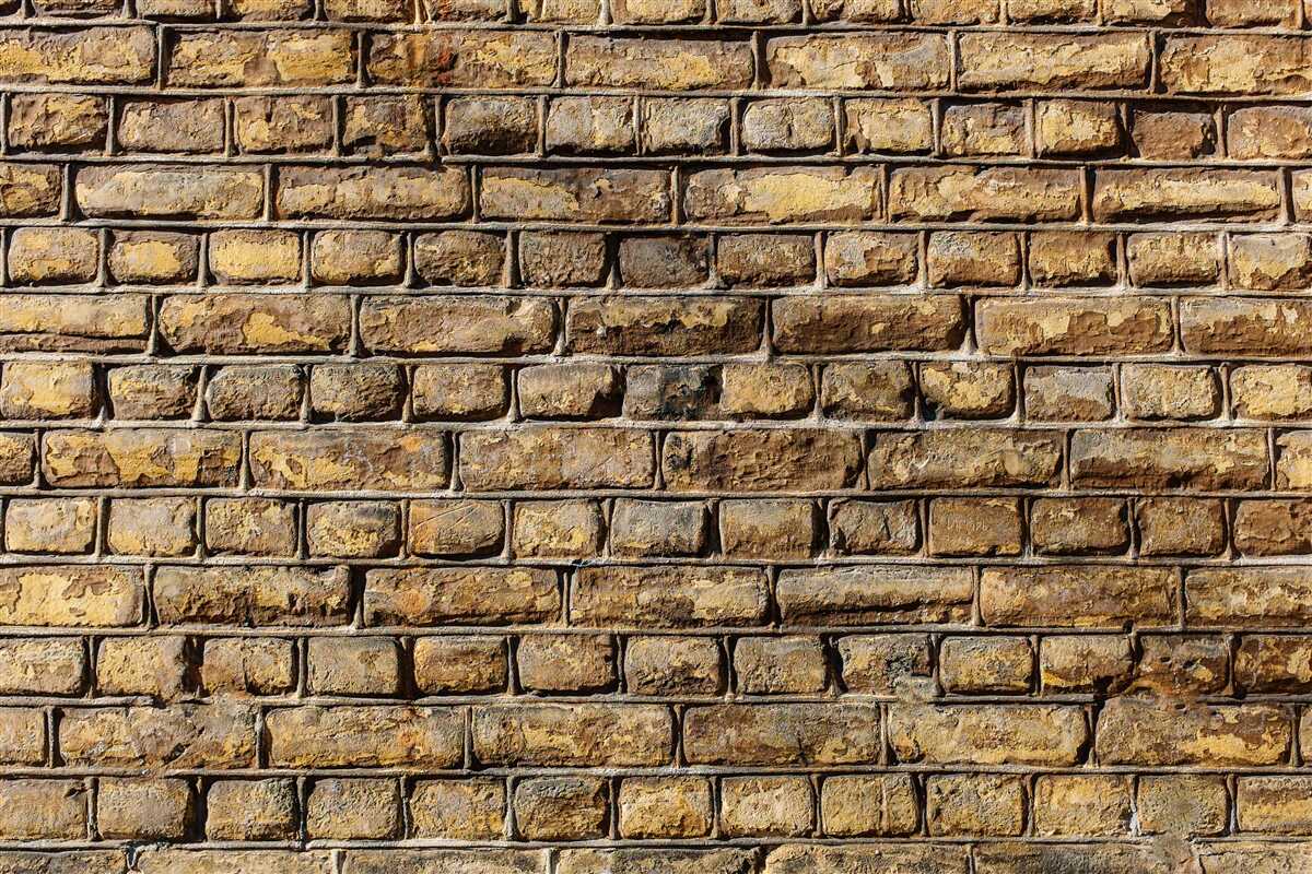 Fototapeten Eine Wand aus harten Ziegeln
