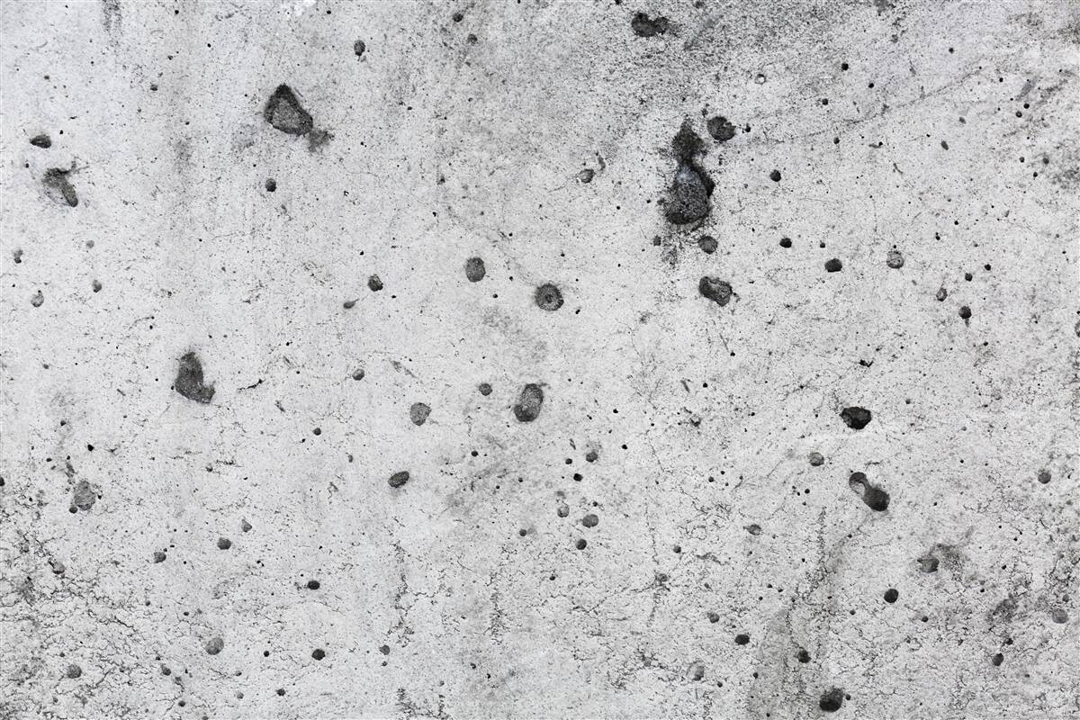 Fototapeten Betonwand mit dunklen Spuren