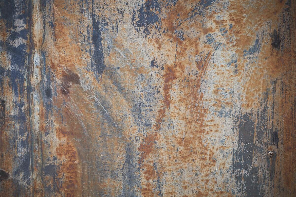Fototapeten Eine undurchsichtige Wand mit Rost bedeckt