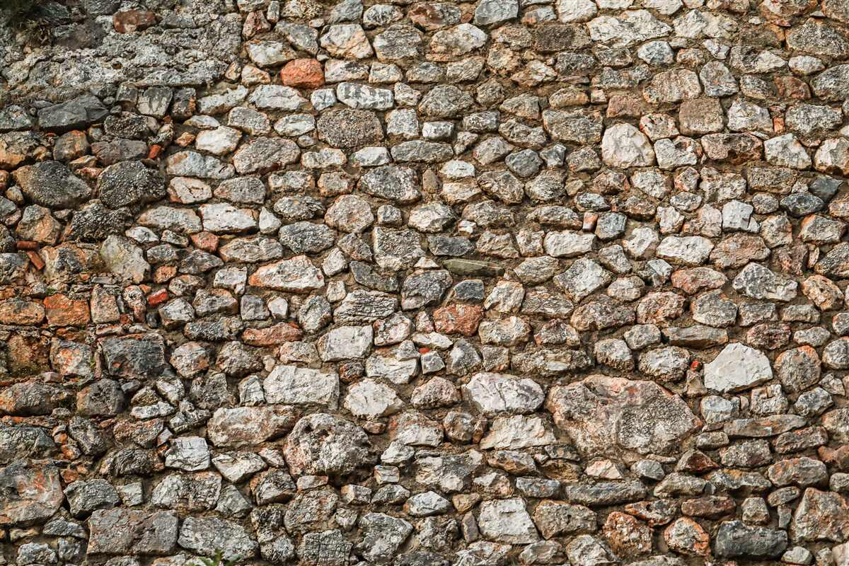 Fototapeten Alte, mehrfach gefärbte Steinmauer