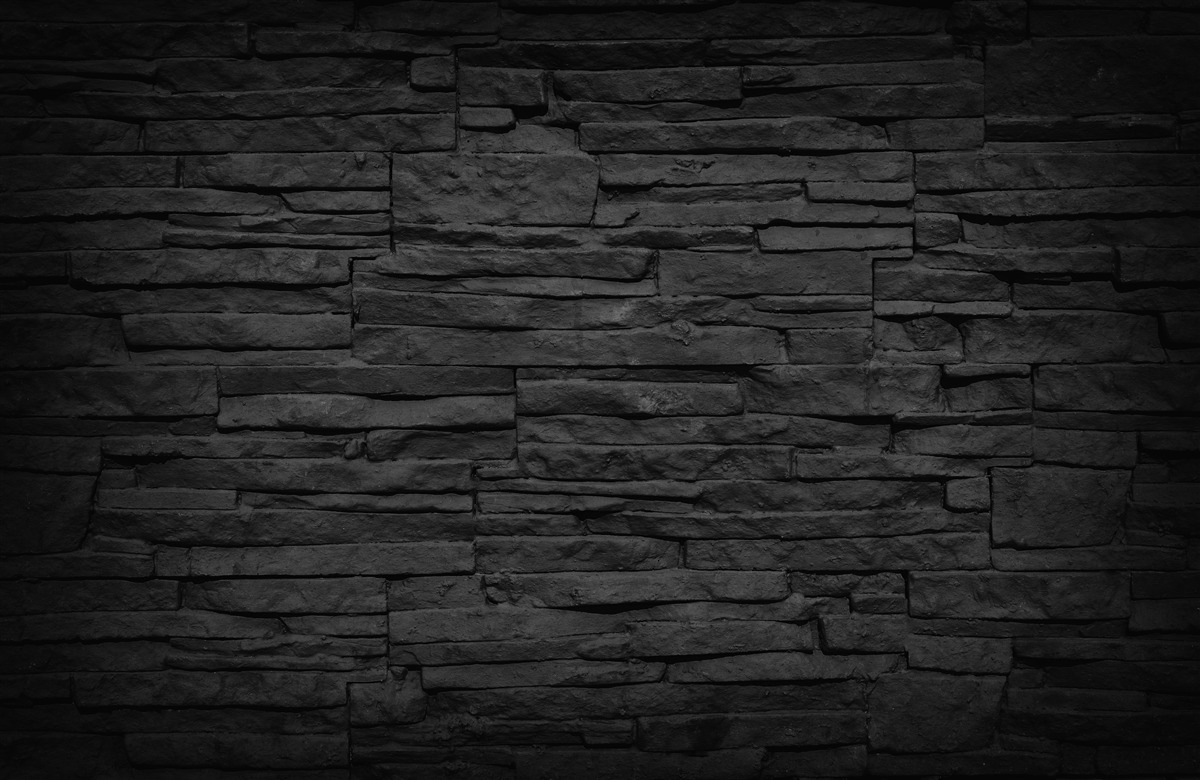 Fototapeten Schwarze Steinmauer