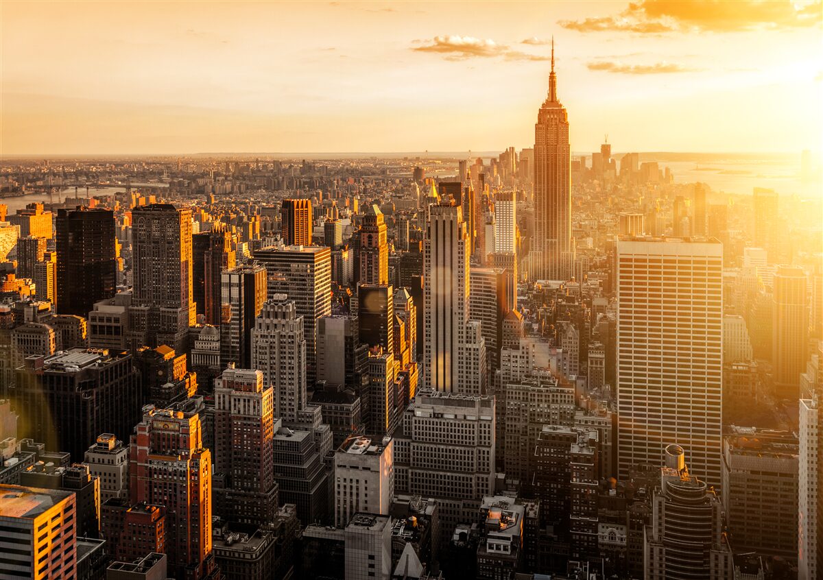Fototapeten New Yorker Wolkenkratzer im Licht der untergehenden Sonne