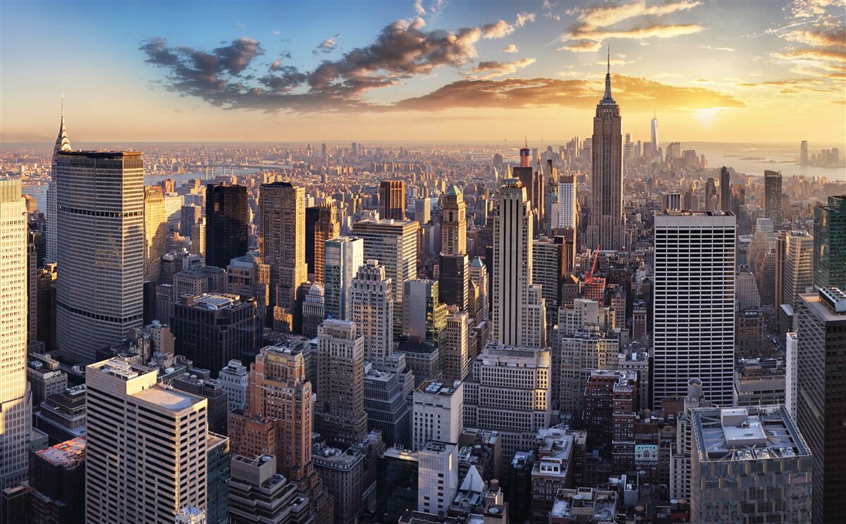 Fototapeten Der Sonnenuntergang wird von New York beleuchtet