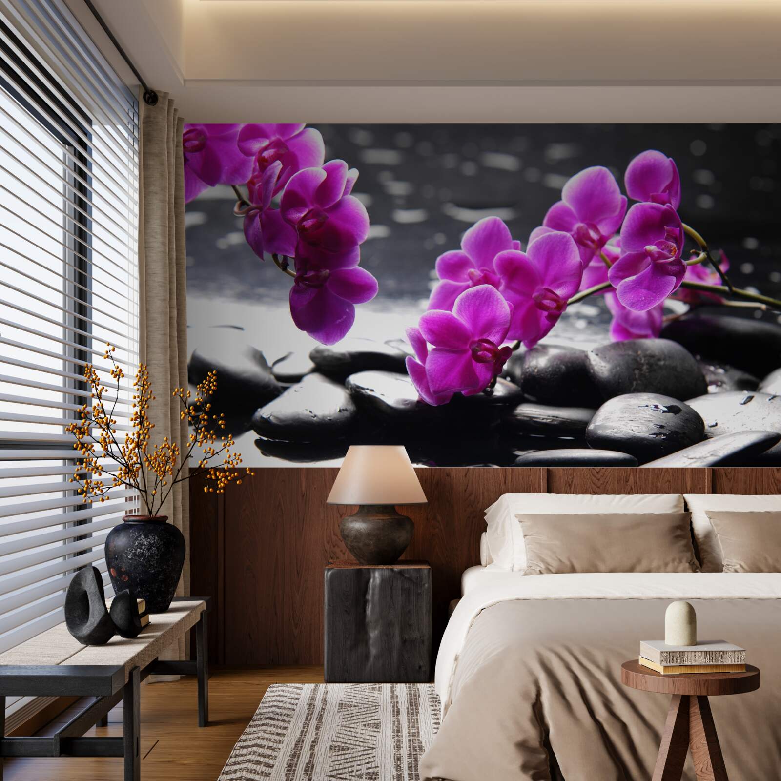 Fototapeten Eine Orchidee mit einem lila Farbton, eingebettet auf matte schwarze Steine