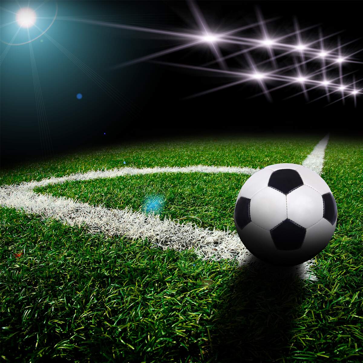 Fototapeten Der Ball liegt auf dem Rasen des Stadions