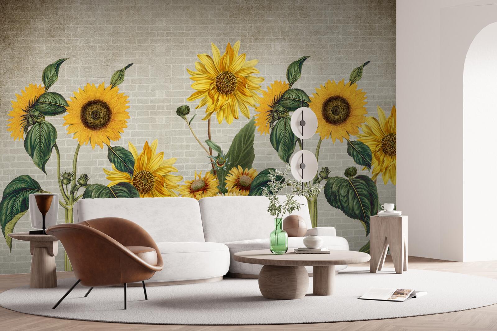 Fototapeten Ziegelmauer mit Sonnenblumen im Vordergrund