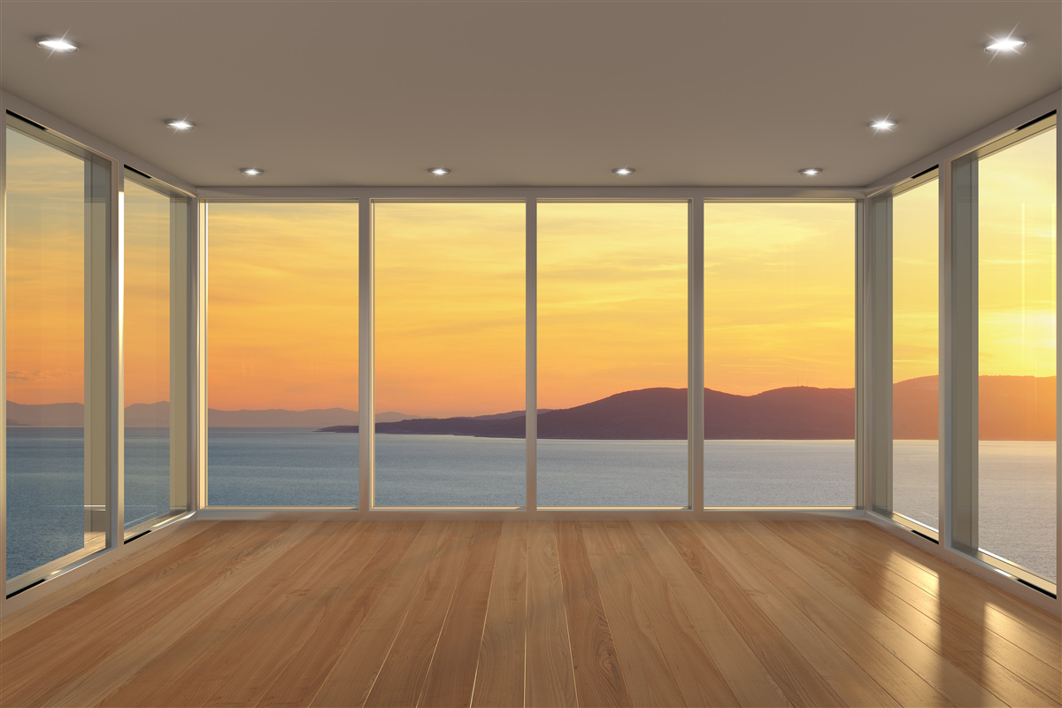 Fototapeten Unglaublich schöne Landschaft aus Sonnenuntergang und Meer aus Panoramafenstern