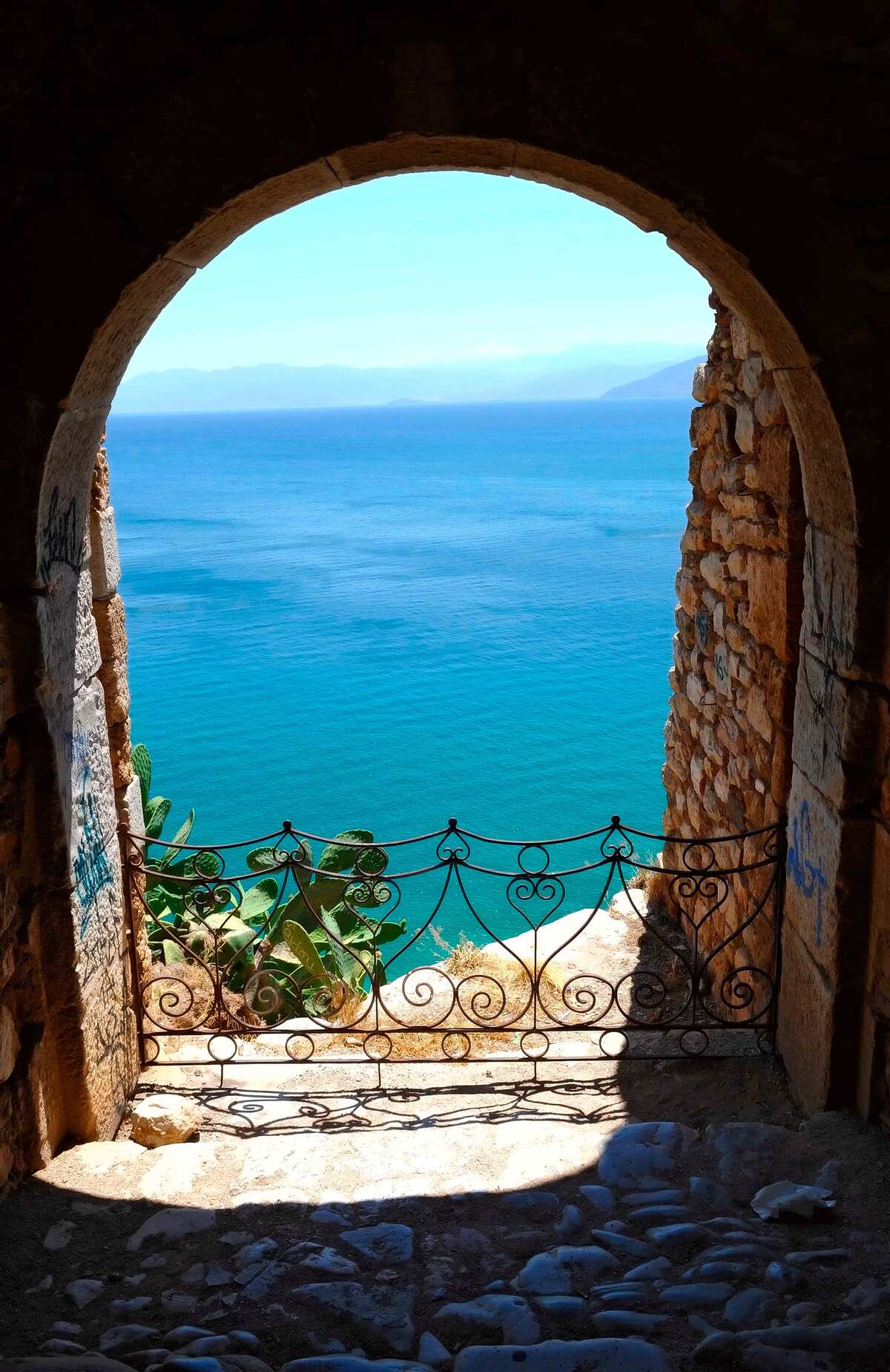 Fototapeten Steinbogen zum Meer
