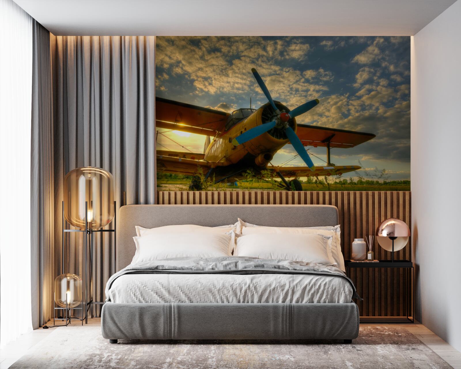 Fototapeten Es gibt ein historisches Flugzeug mit einem Propeller auf dem Feld