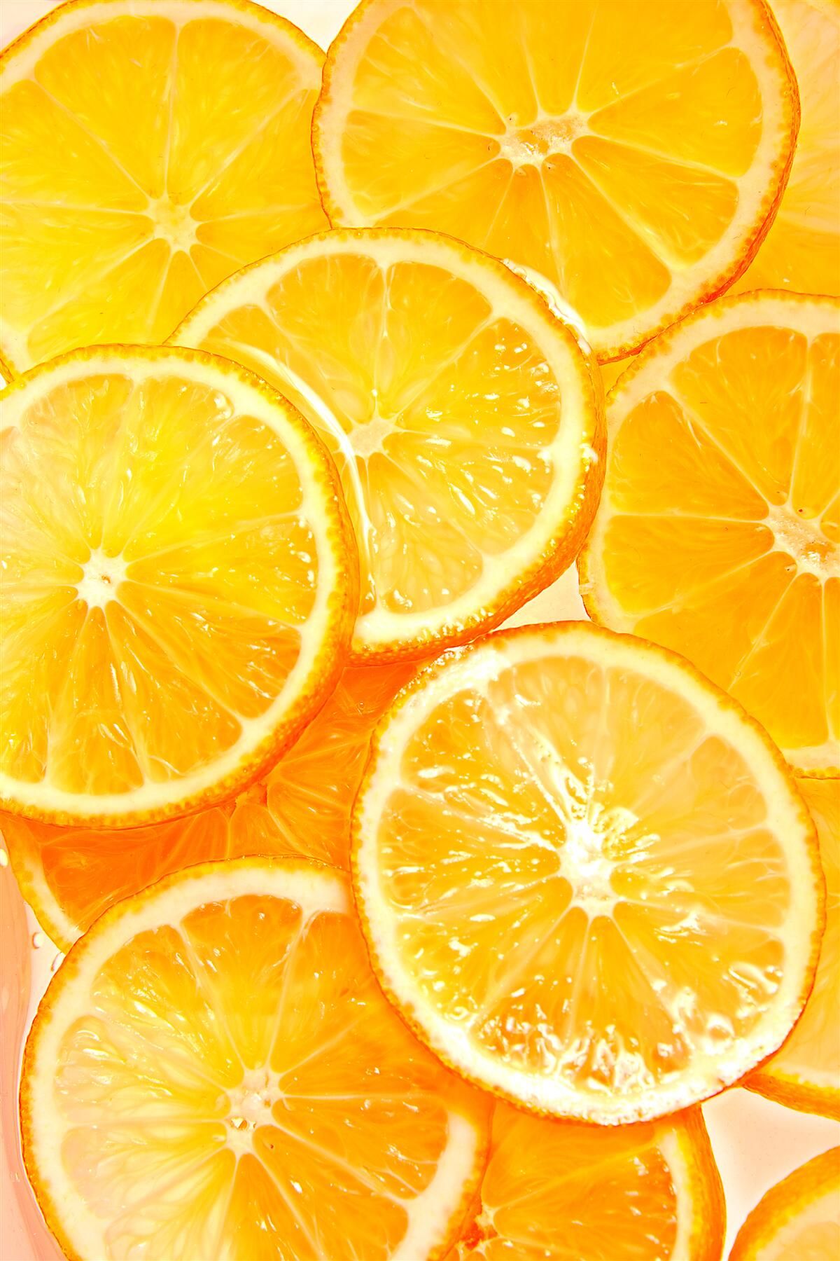 Fototapeten Saftige und helle Orangenscheiben