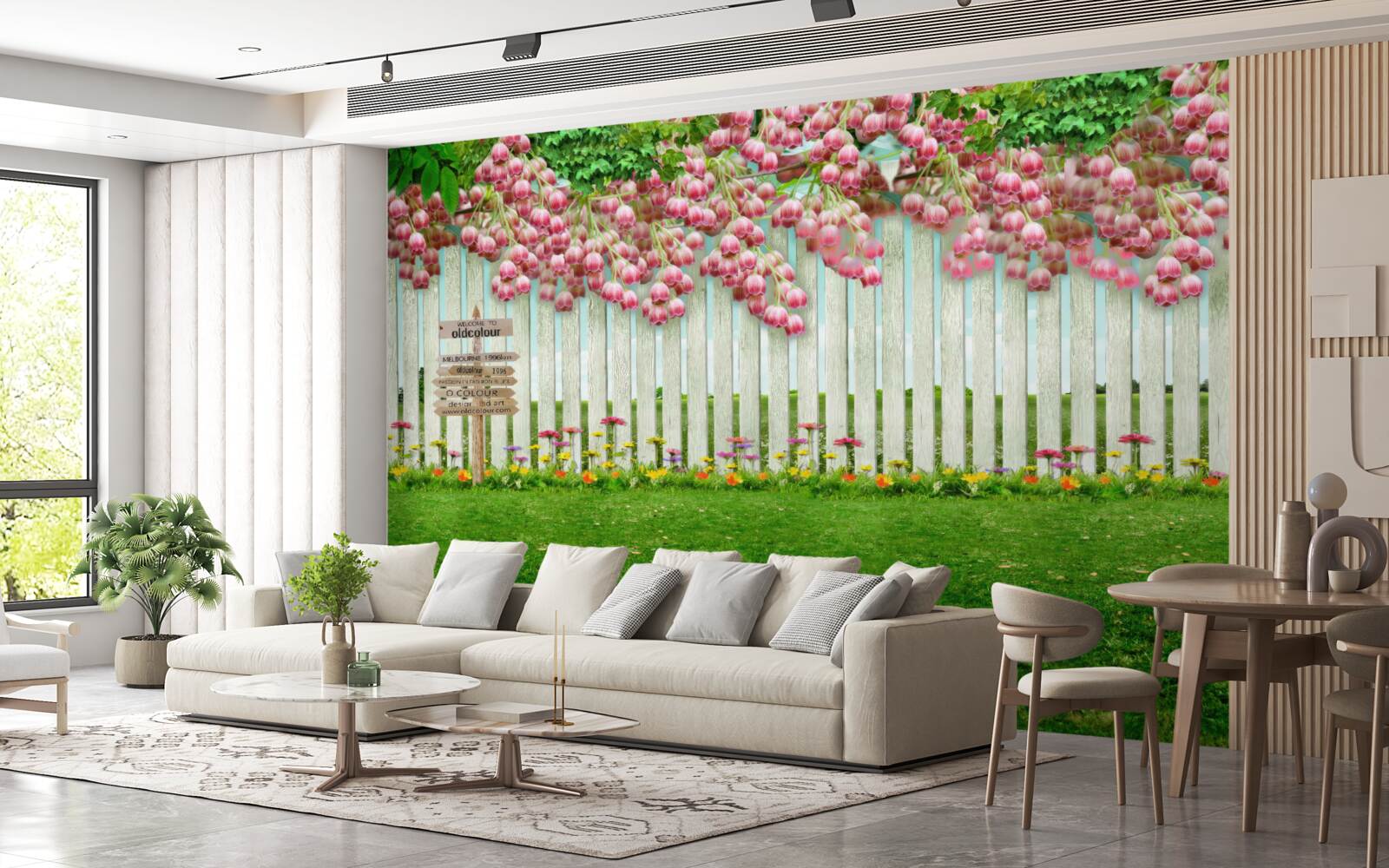 Fototapeten Rosa Blumen fließen durch eine Kaskade durch den weißen Zaun