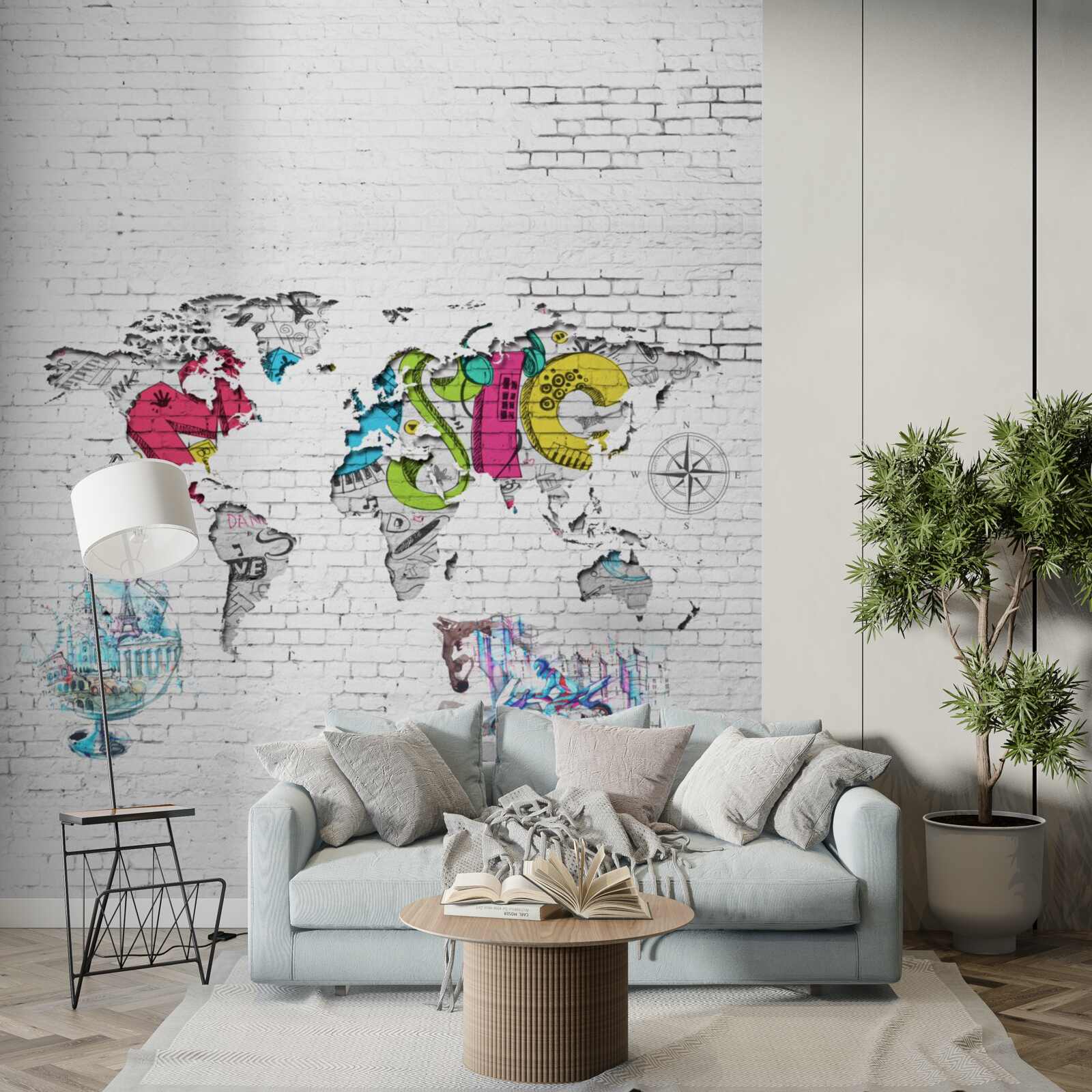 Fototapeten Karte der Welt in verschiedenen Farben an einer weißen Wand